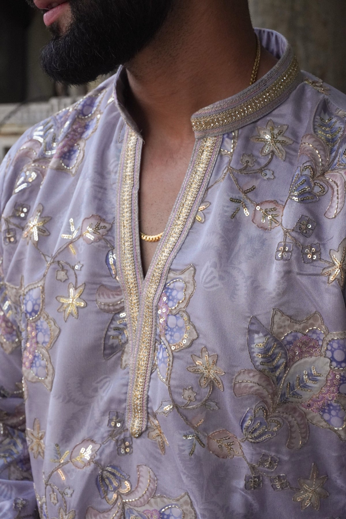 Close-up of gold zari neckline and sequin embroidery on Gulnaar kurta