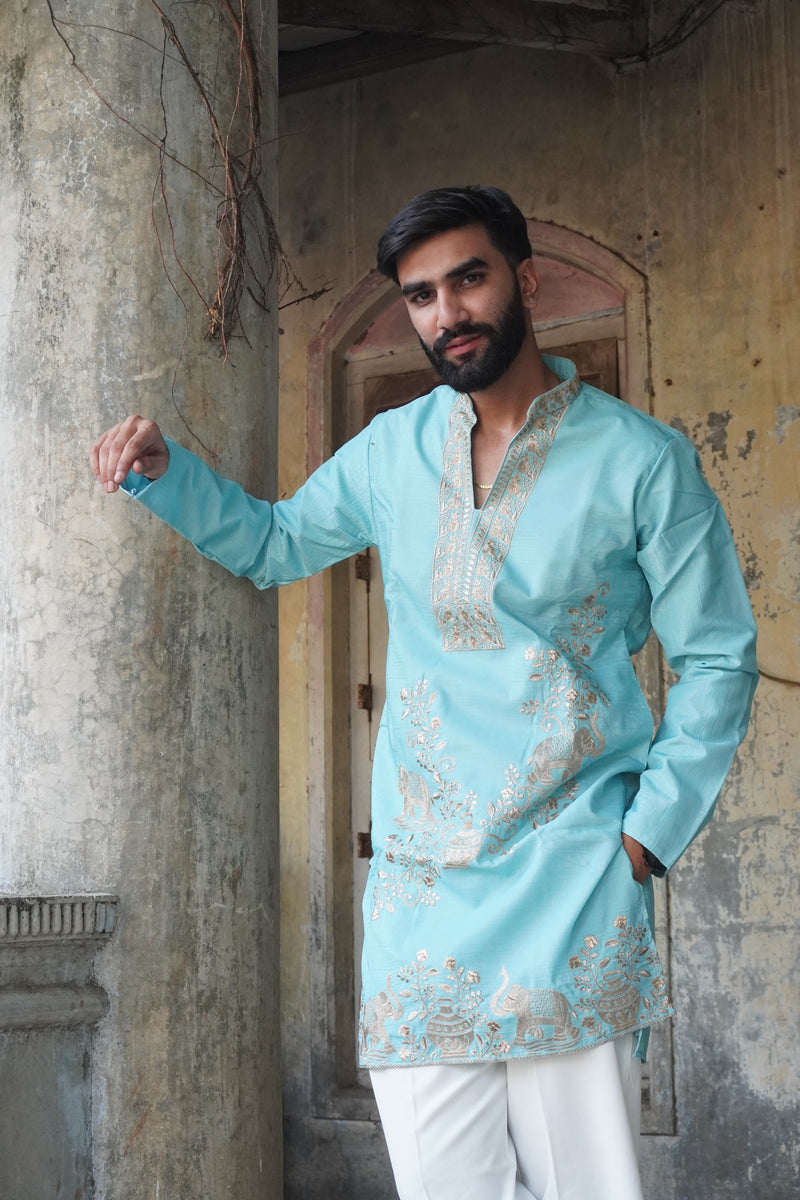 Airavat turquoise kurta styled with white trousers