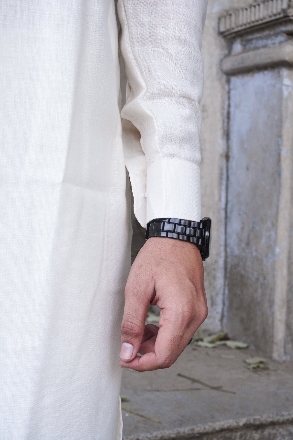 Close-up of shirt-style cuff and linen-look texture