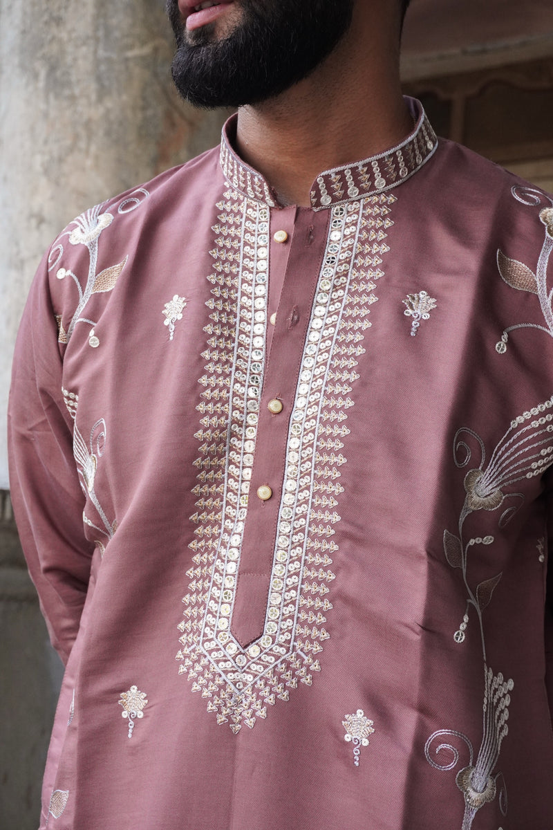 Close-up of sequin-embroidered placket and mandarin collar