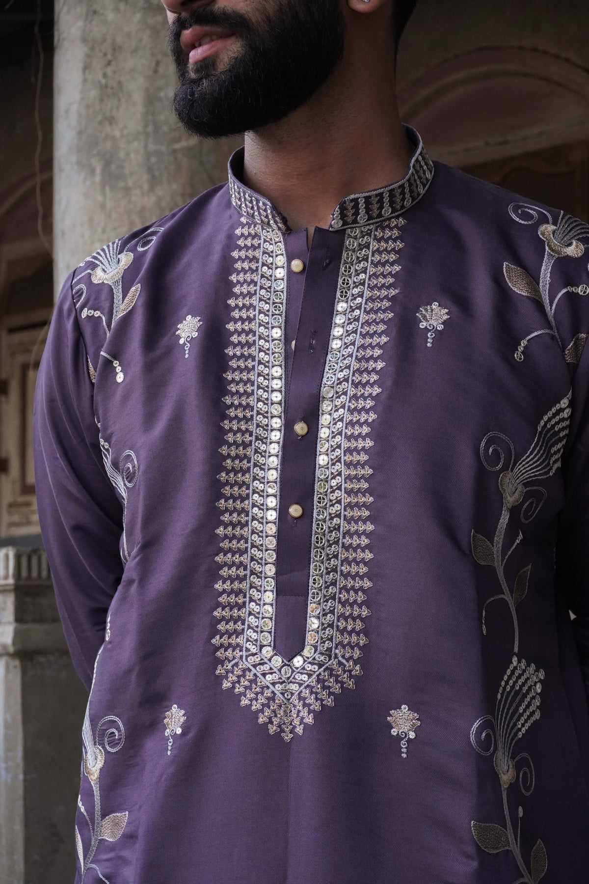 Close-up of sequin placket and embroidered collar on purple kurta