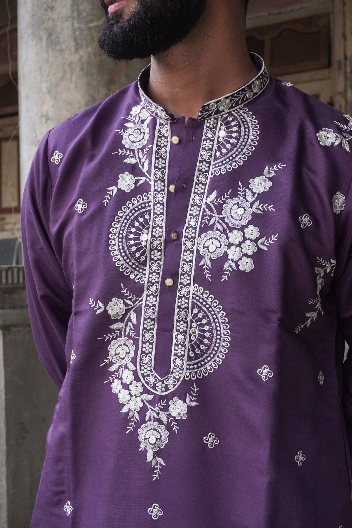 Close-up of mandala medallions and placket embroidery on purple kurta