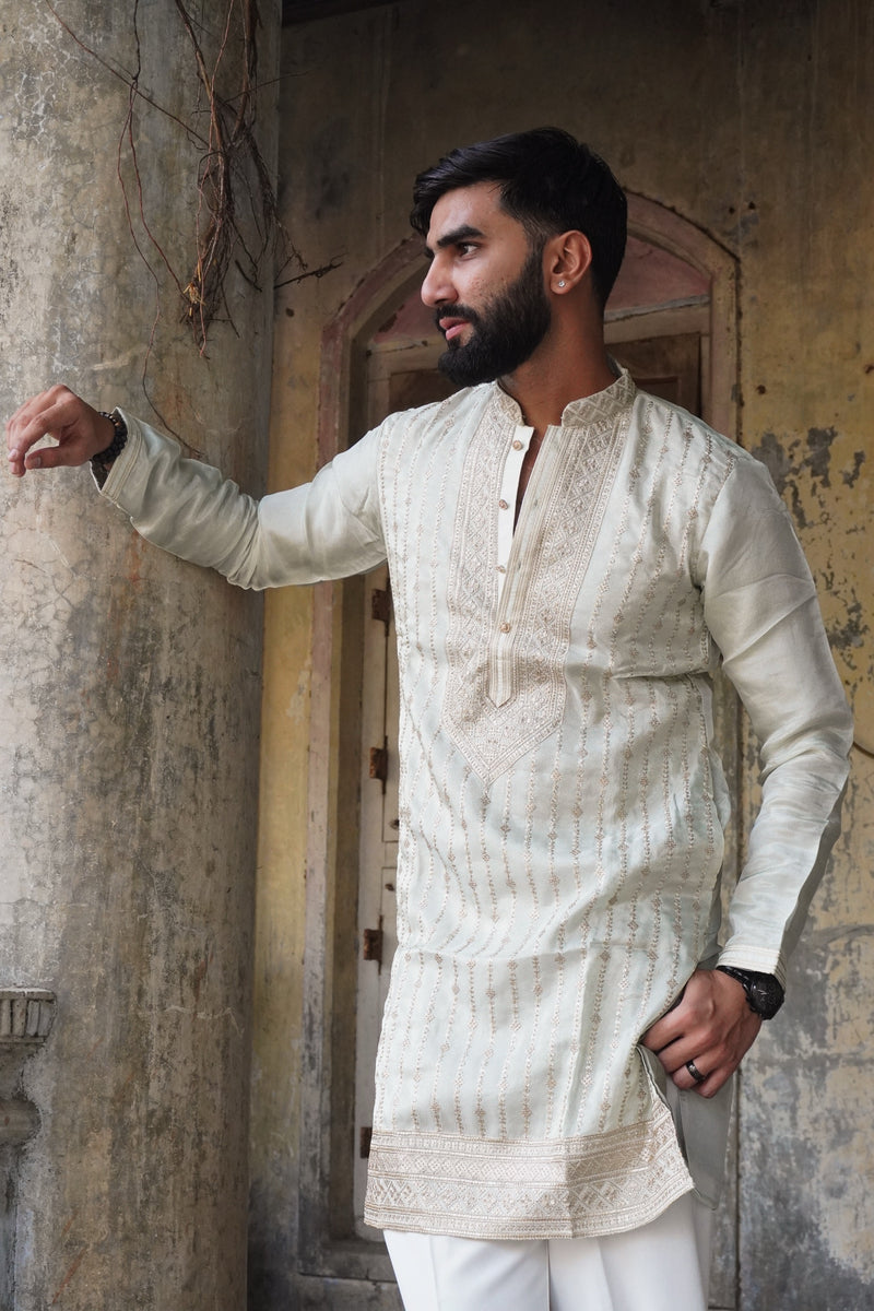 Sukoon light green kurta side pose with embroidered hem