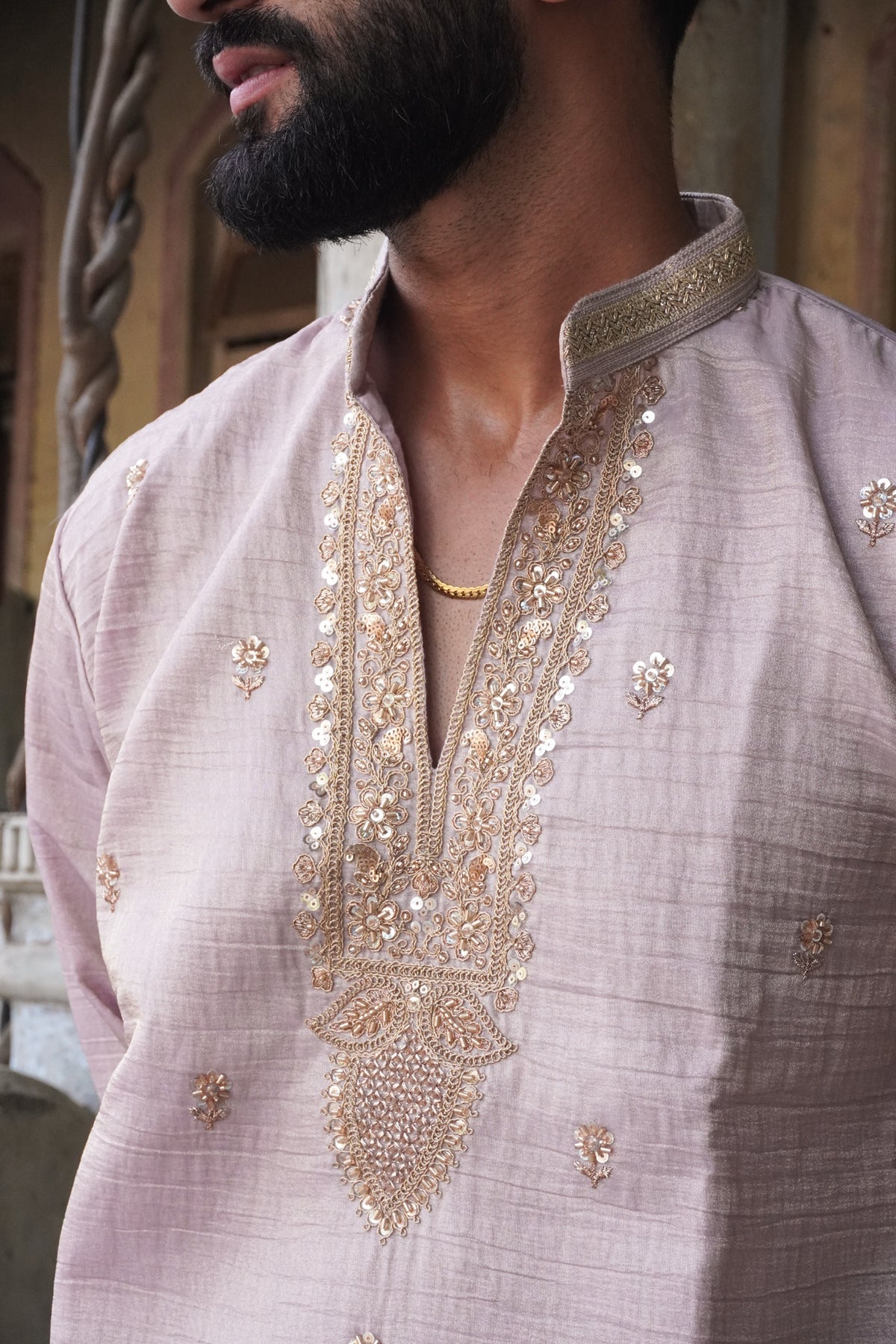 Close-up of rose-gold embellished yoke and zari collar on Zariyaan kurta